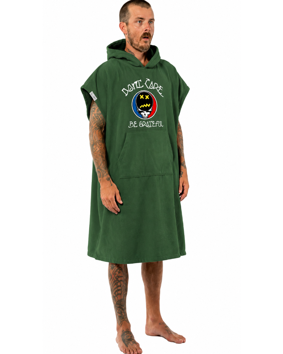 Man wearing a green hooded poncho with a logo on a white background