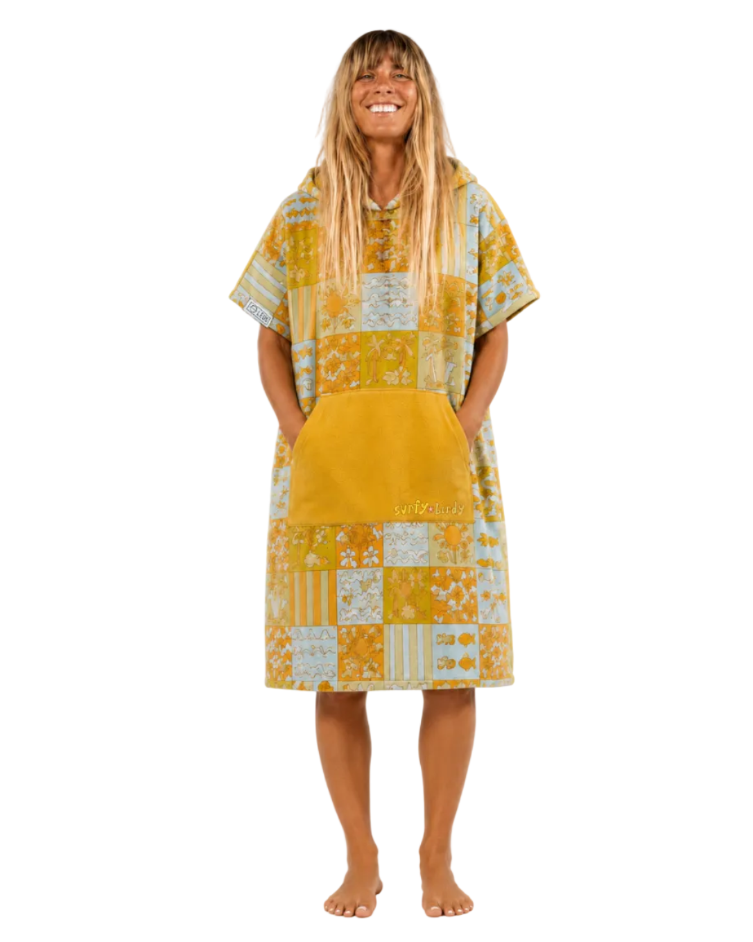 Woman wearing a yellow patchwork dress on a white background