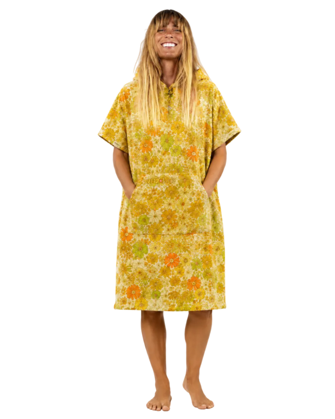 Woman wearing a yellow floral dress on a white background
