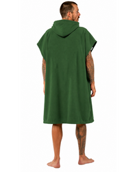 Person wearing a green hooded towel on a white background