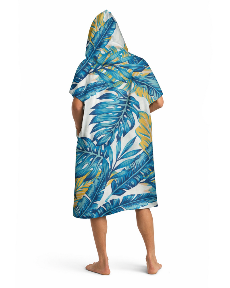 Man wearing a blue tropical leaf patterned robe on a white background