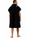 Man wearing a black hooded towel with a logo on the back